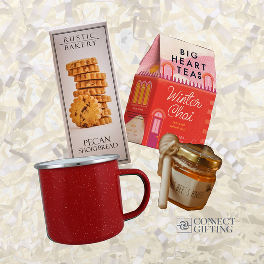 Warm Regards holiday gift set from Connect Gifting with Big Heart Tea Co. winter chai, mini honey with wooden dipper, Rustic Bakery pecan shortbread, and a red enamel campfire mug